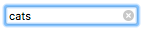 Fokussiertes Suchfeld, mit Fokusring, mit dem Text 'Katzen'. Es gibt ein x-Symbol im Eingabefeld rechtsseitig.